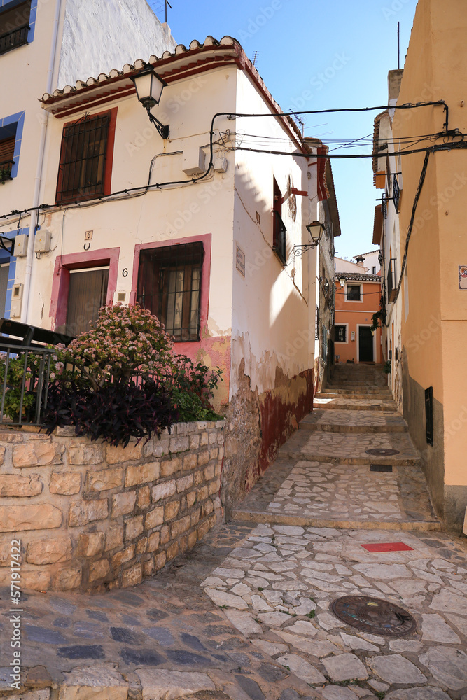 Narrow cobbled street and facades in Finestrat village