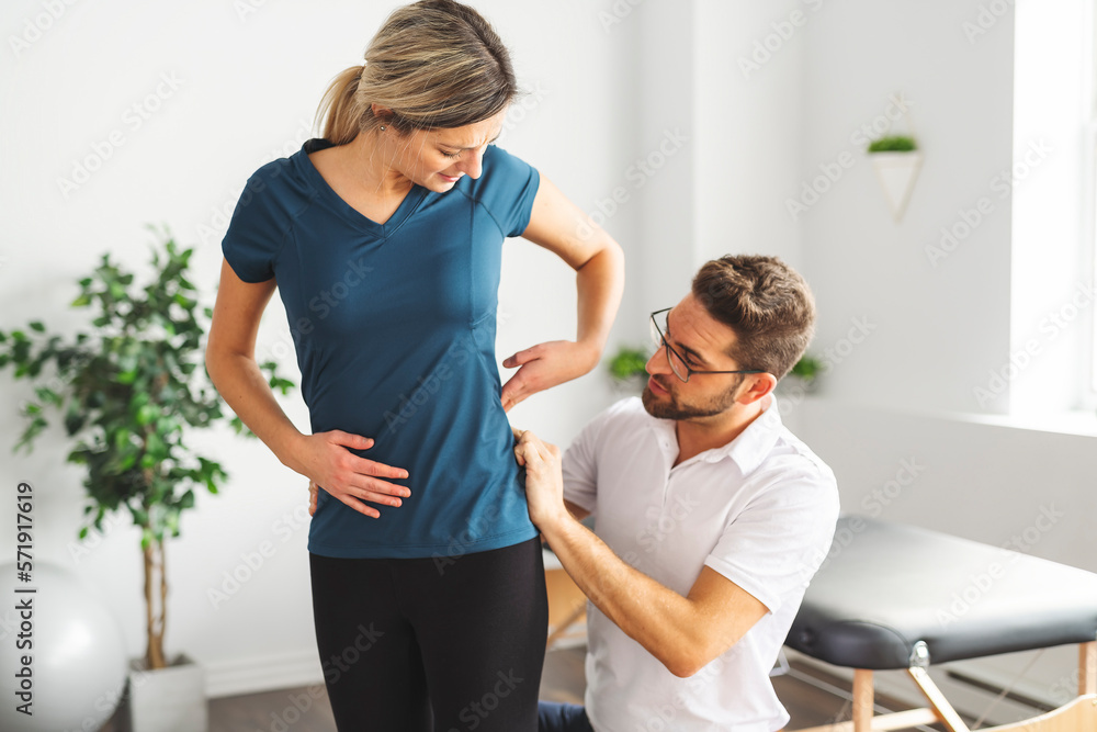 Fototapeta premium A Modern rehabilitation physiotherapy man at work with woman client