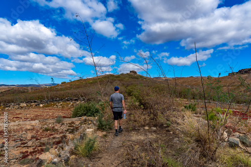 a man hiking along a small path in the wilderness of Gran Canaria, Spain