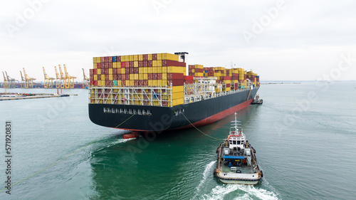 cargo container ship sailing in sea to import export goods transportation and commercial port background, aerial photography from drone,