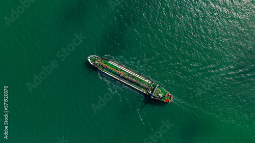 Oil Ship tanker or Liquid fied Petroleum Gas (LPG) sailing in green sea aerial top view © SHUTTER DIN