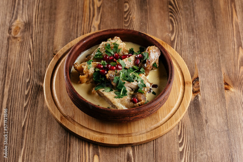Georgian cuisine, meat and vegetables on a wooden background