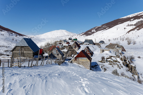 View of a mountain village during winter. Snow white landscape and mountaineer lifestyle. 