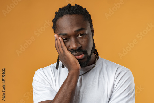Papier peint Young african man wearing casual clothes clueless and confused