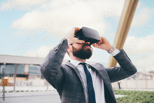 Canvas Print Elegant executive professional businessman bearded using 3D viewer outdoor explo