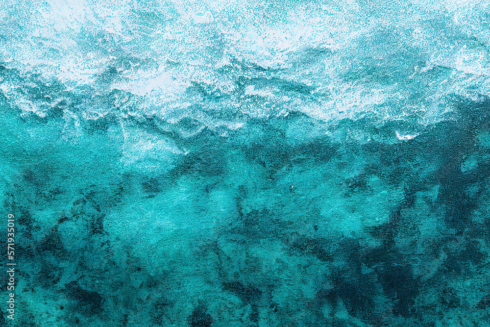 Top-down view of a turquoise sea with a textured background. The water is transparent enough to reveal the relief and structure of the ocean floor, evoking the idea of diving or a sea journey