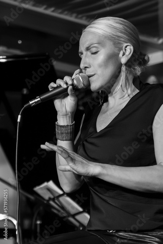 Black and white portrait of a singer while performing in concert photo