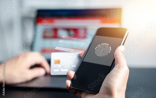 Shopping online payment E-commerce concept. Man hand using smart phone key card number on credit card, banking and online shopping via mobile banking app, E-transaction and financial technology