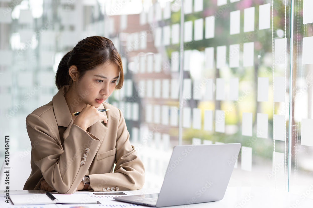 Serious business woman working in the office. Serious business woman working in the office.