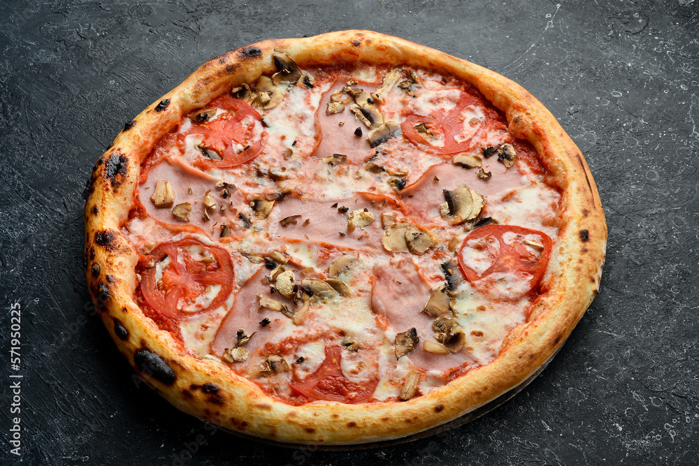 Pizza Margarita with bacon, mushrooms and cheese. Takeaway food. Top view. On a black stone background.