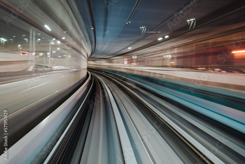 Motion blurred of train moving inside tunnel with daylight in tokyo  Japan.