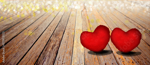  Valentines day background with two red hearts on wooden background