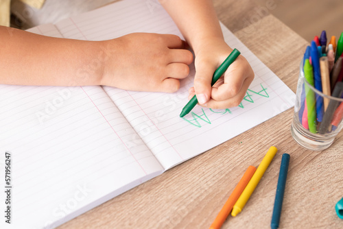 boy writing in a notepad