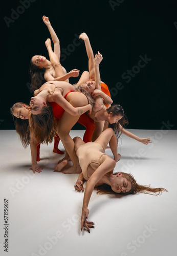 Diversity. Directions of movements. Young girls in bodysuits, contemporary, experimental dancers over black background. Concept of art, youth, fashion, artistic lifestyle, flexibility, inspiration