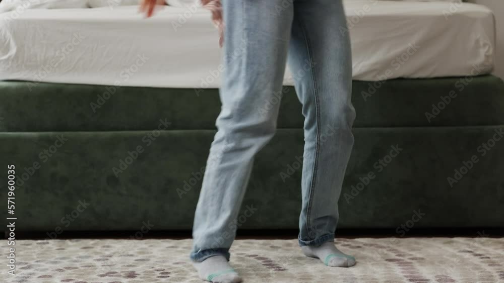 Unrecognisable person is dancing merrily at home. Legs close-up Unrecognisable person is dancing merrily at home. Legs close-up