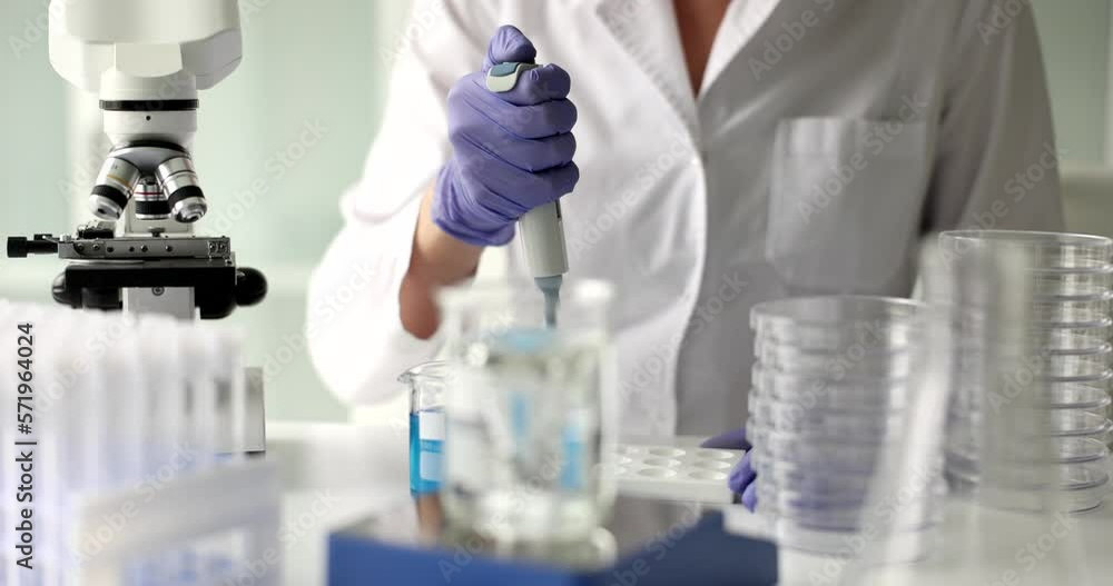 Scientist works in science laboratory with test water samples Scientist works in science laboratory with test water samples