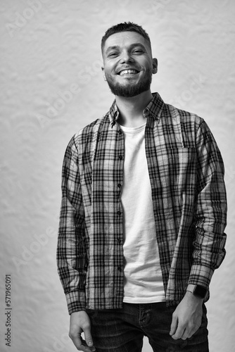 bearded man looking at camera on white background