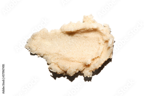 Sugar scrub texture smear isolated on white background. Beauty cosmetic smudge such as salt scrub, lip balm, body skincare cream, top view with shadow.