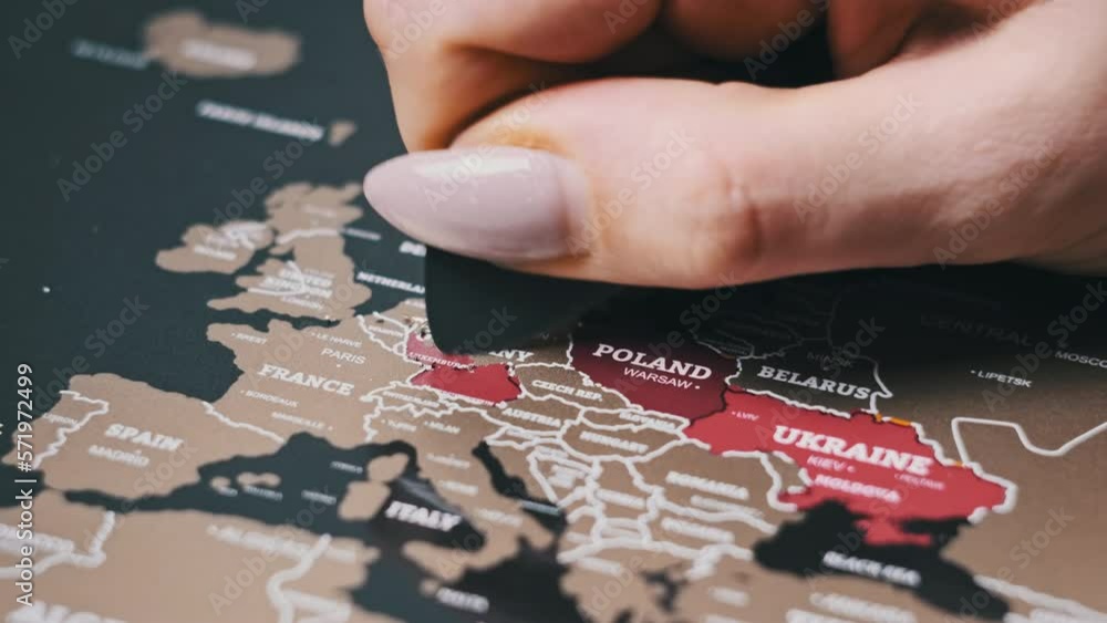 Female Hand Scratching Germany Country on the Surface of Scratch World