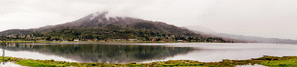 panorama lake Buyan against background of mountain and fog