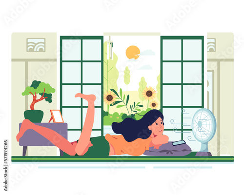 Boring vacation Lie down and play the mobile phone in front of the fan