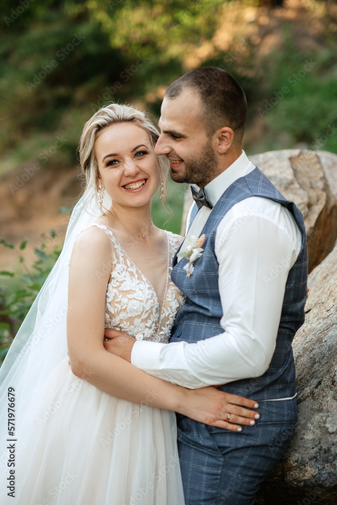 the groom and the bride are walking in the forest the groom and the bride are walking in the forest