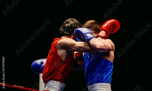 clinch fighting boxers boxing match on black background
