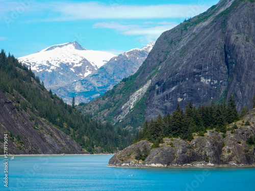 An Alaskan Fjord in the Summer with a Glacier Capped Mountain in the Background