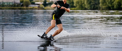 Photography wakeboarding on summer lake. extreme sport on vacation
