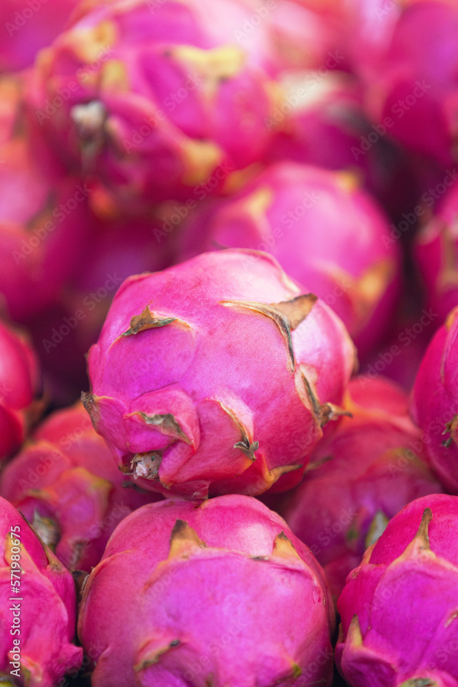 Stack of dragon fruits on a market stall Stack of dragon fruits on a market stall