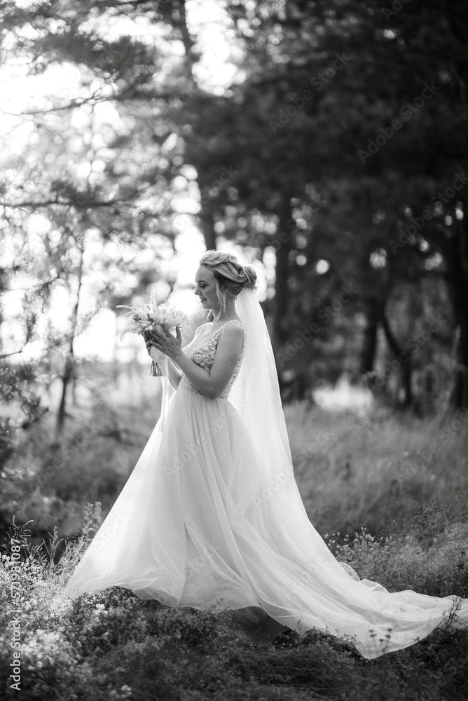 bride blonde girl with a bouquet in the forest bride blonde girl with a bouquet in the forest