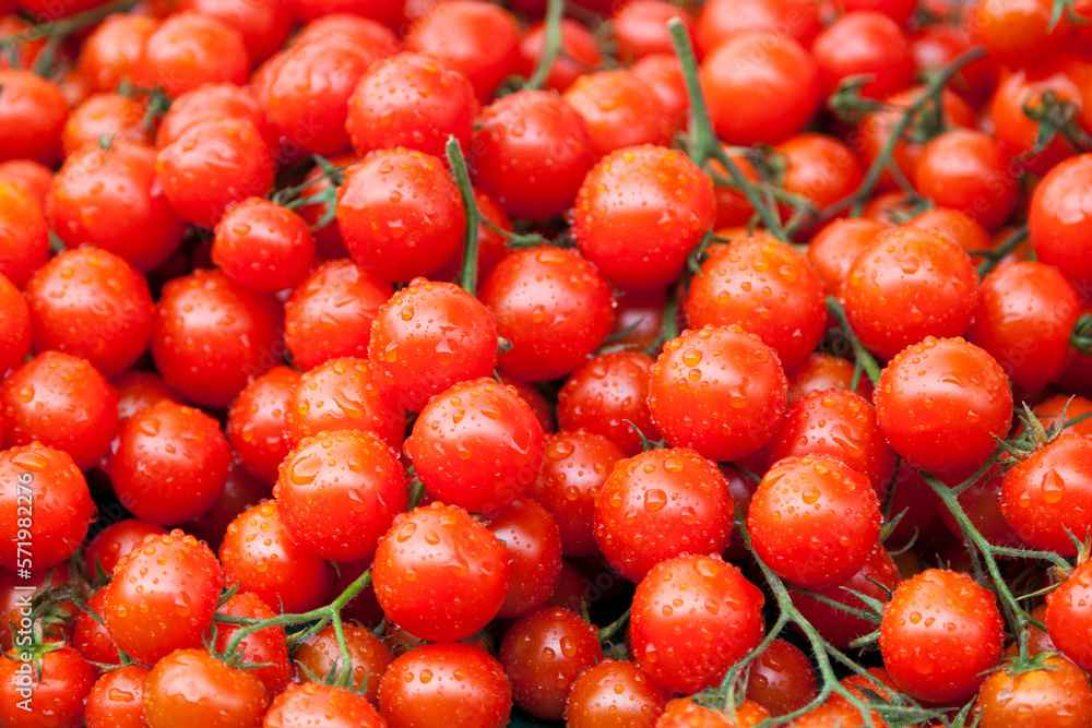 Stack of cherry tomatoes on a market stall Stack of cherry tomatoes on a market stall