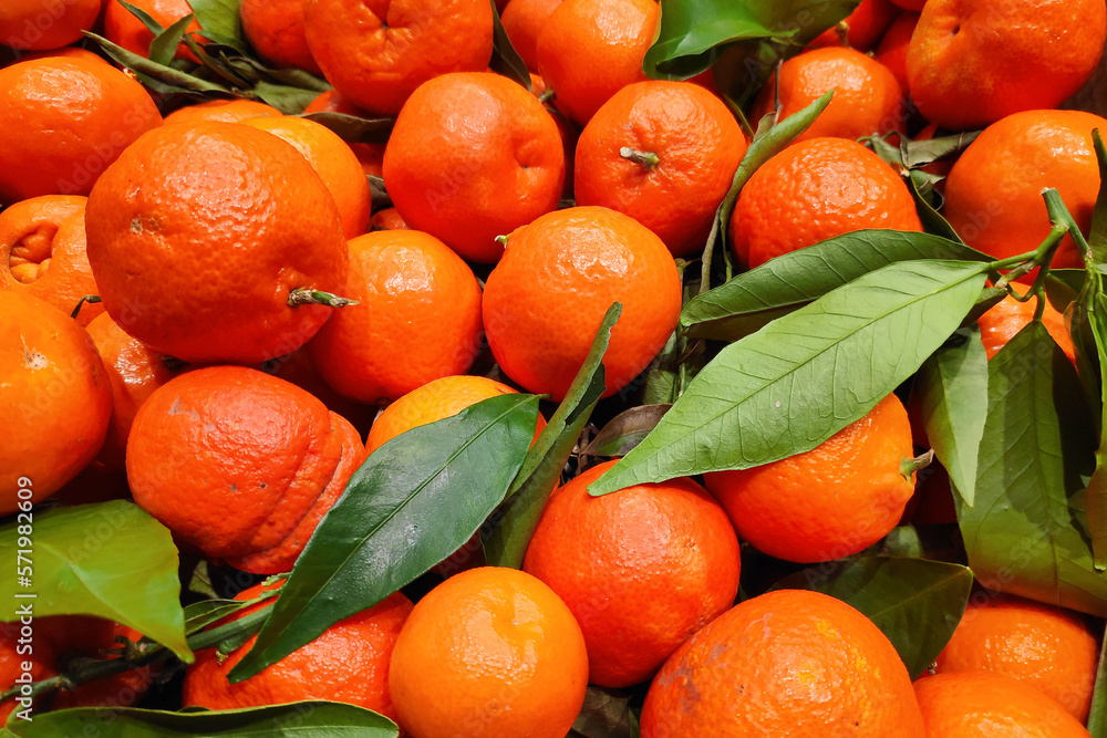 Stack of clementines on a market stall Stack of clementines on a market stall
