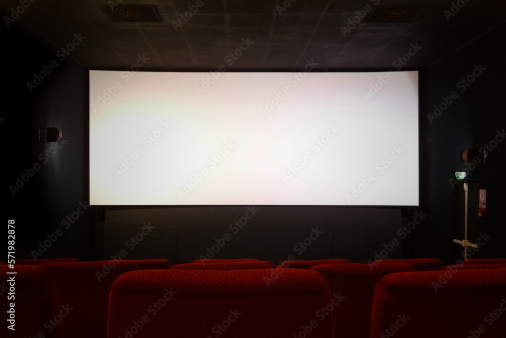 Empty movie theater with blank screen