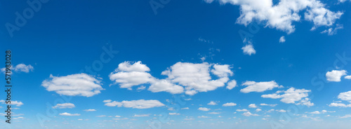 Panoramic fluffy cloud in the blue sky. Sky with cloud on a sunny day.