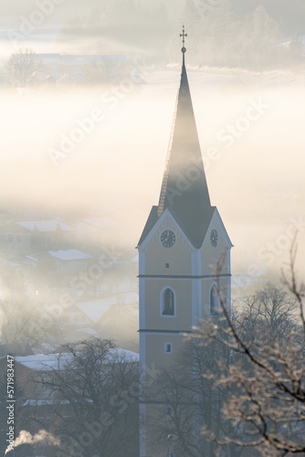 Church in windischgarsten with sun lights and fog