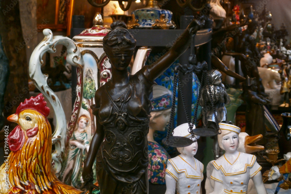 Bronze statue of Lady Justice for sale in a flea market