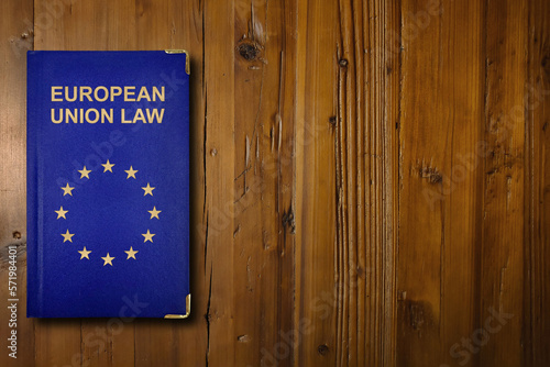 European Union law book on a wooden desk