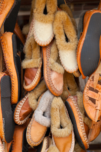 Stack of Opanci for sale on a market stall photo