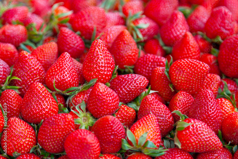 Stack of strawberries on a market stall Stack of strawberries on a market stall