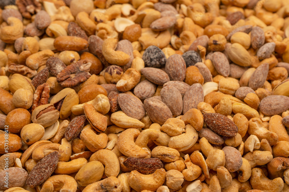 A group of almonds, pistachios, walnuts, macadamia, cashews. A group of almonds, pistachios, walnuts, macadamia, cashews.