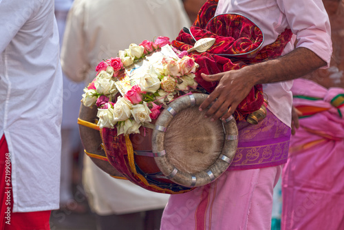 Photography Musician playing with a Thavil during a Tamil procession