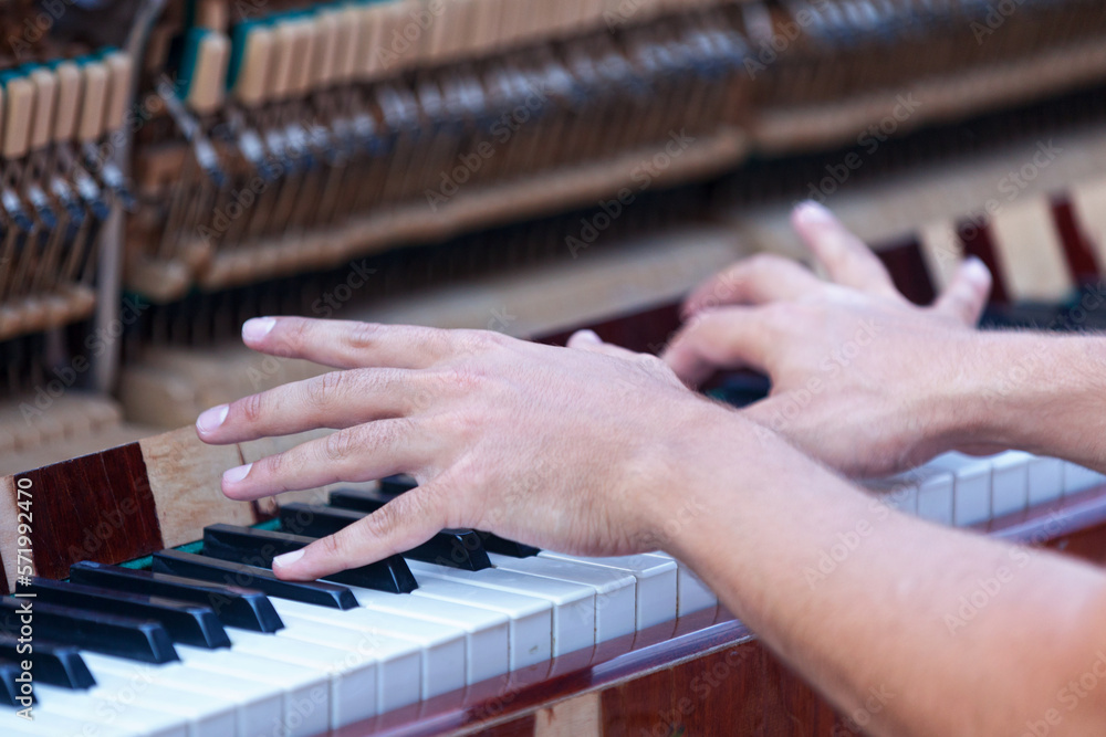 Obraz premium Pianist playing on a upright piano