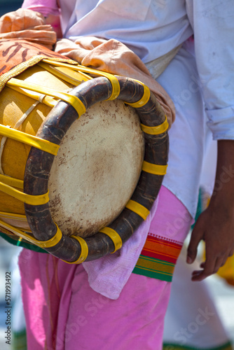 Musician playing with a Thavil during a Tamil procession photo