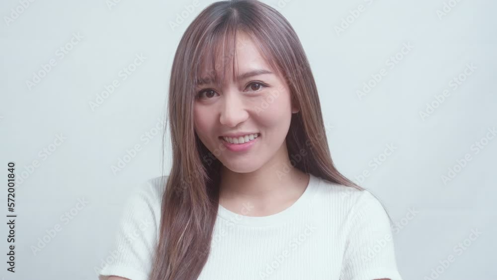 Portrait of young beautiful woman smiling over white background studio.. Portrait of young beautiful woman smiling over white background studio..