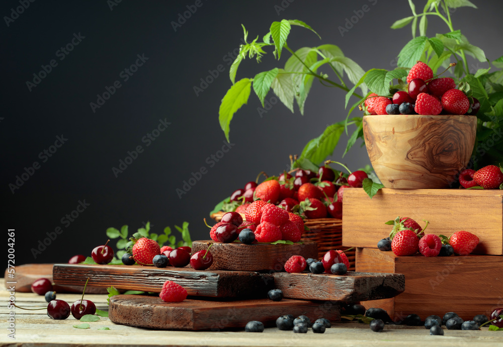 Assorted fresh berries with leaves. Assorted fresh berries with leaves.