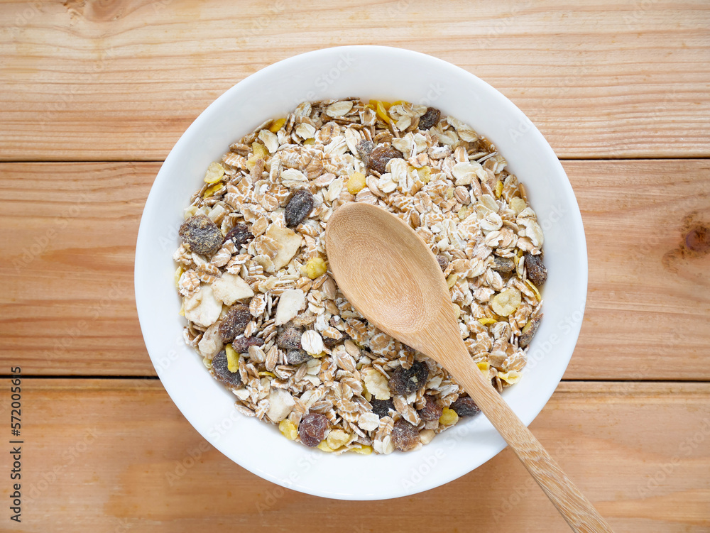 A Bowl of muesli breakfast and rolled oats with dried fruits A Bowl of muesli breakfast and rolled oats with dried fruits