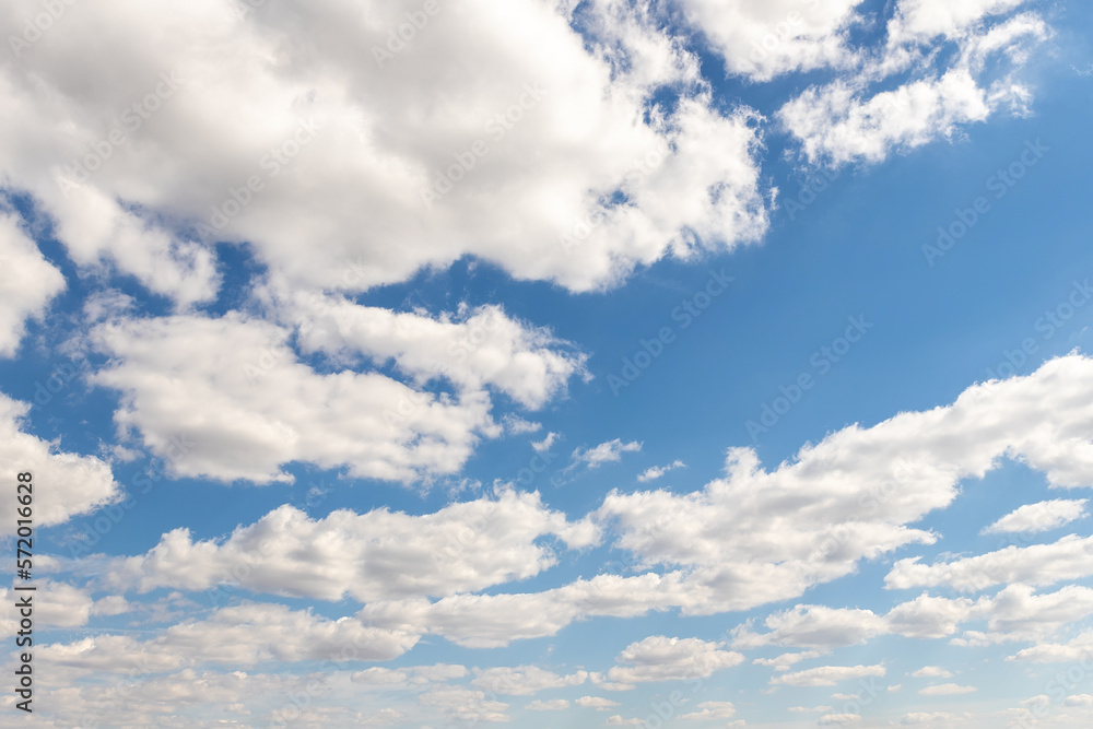 Natural beautiful abstract scenic azure blue sky with white cumulus clouds background on bright sunny summer day. Nature cloudscape tranquil landscape scene backdrop pattern Natural beautiful abstract scenic azure blue sky with white cumulus clouds background on bright sunny summer day. Nature cloudscape tranquil landscape scene backdrop pattern