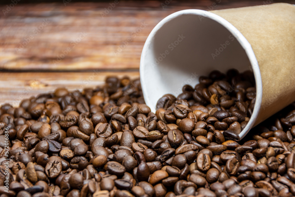 Paper coffee cup with coffee beans Paper coffee cup with coffee beans