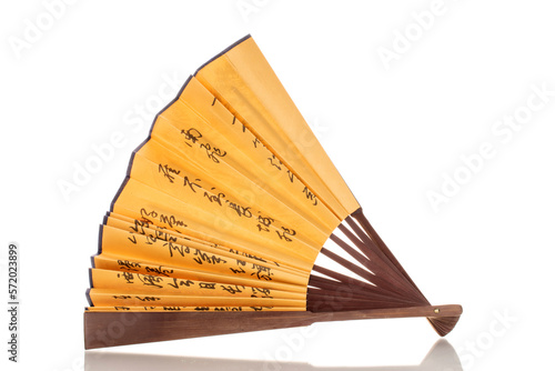 One folding bamboo fan  macro  isolated on white background.